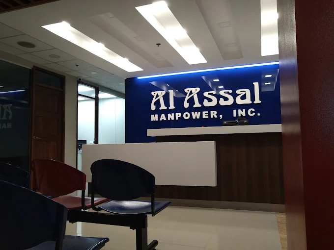 Interior of the Al Assal Manpower Main Office in Manila with company logo on the wall